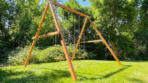 swing set using old skid steer|old wooden swing set.